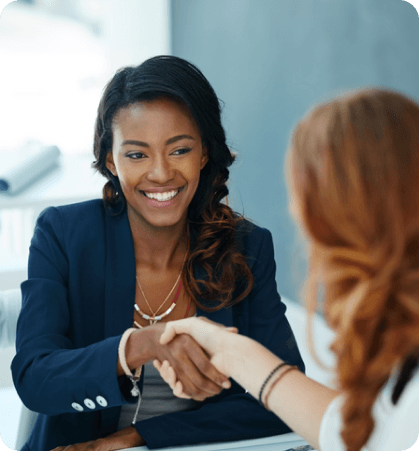 Two girls shaking hands